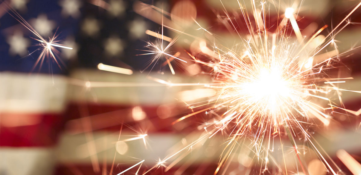 Sparklers against a United States flag background